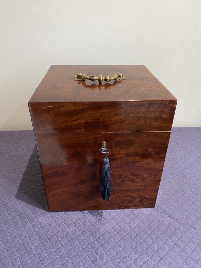 Georgian mahogany box with lined interior and fine quality cast brass carrying handle.