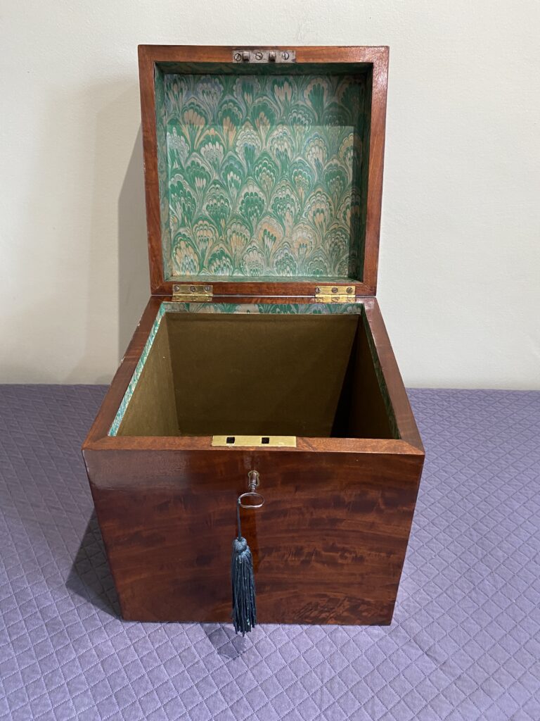 Georgian mahogany box with lined interior and fine quality cast brass carrying handle.