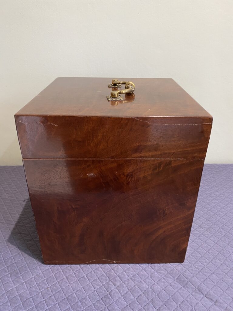 Georgian mahogany box with lined interior and fine quality cast brass carrying handle.